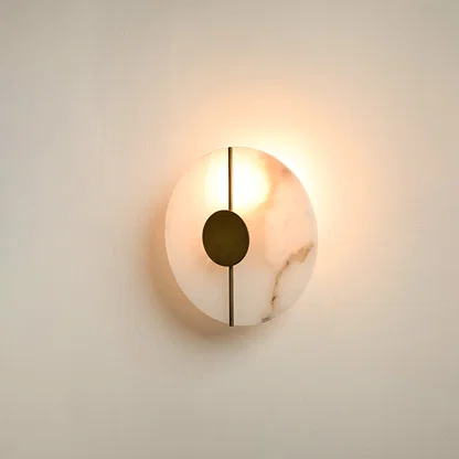 Modern marble wall light with warm ambient glow for stylish bedroom and premium decor styling spaces.


