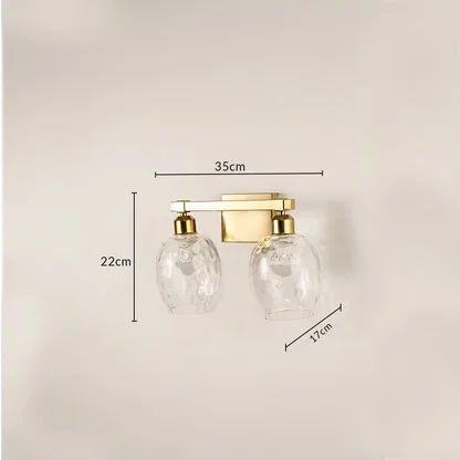 Brushed gold double wall light with hammered glass shades measuring 22 cm height 35 cm width and 17 cm depth shown for accurate placement.