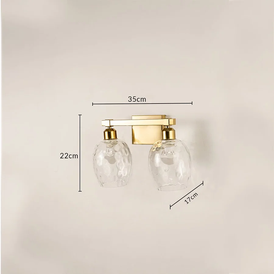 Brushed gold double wall light with hammered glass shades measuring 22 cm height 35 cm width and 17 cm depth shown for accurate placement.