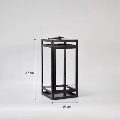 Black metal lantern showing 37 cm height and 18 cm width dimensions suitable for tabletop floor or porch decorative lighting placement.