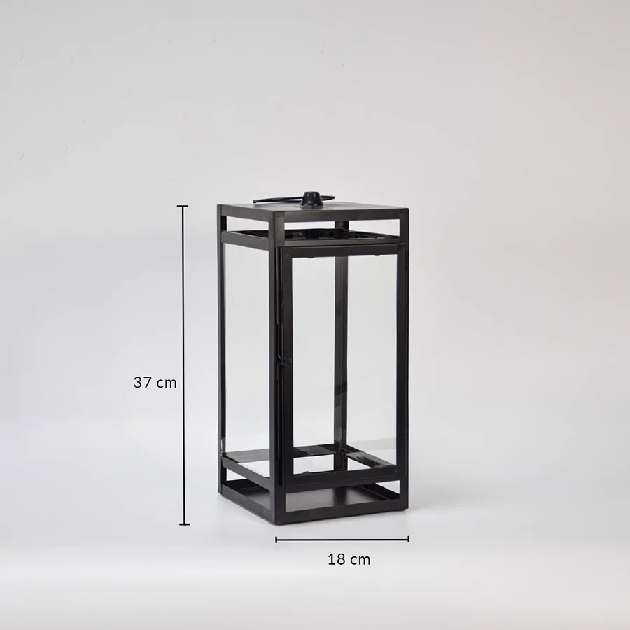 Black metal lantern showing 37 cm height and 18 cm width dimensions suitable for tabletop floor or porch decorative lighting placement.