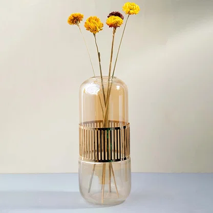 Bright yellow dried daisy stem styled in a warm modern room adding a cheerful natural touch to contemporary home decor.