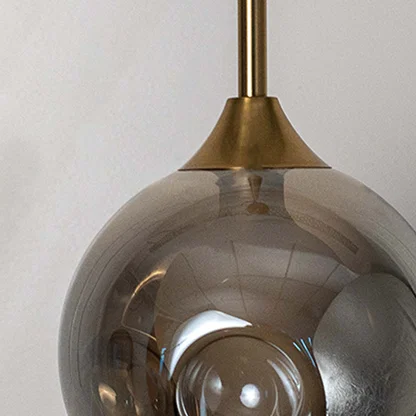 Detailed view of smoky glass globe pendant light highlighting smooth curves and premium finish.