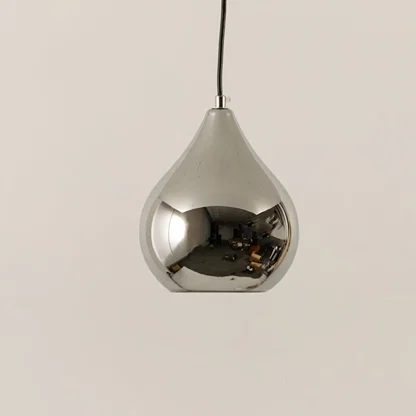 Silver metal pendant light illuminated to showcase reflective modern ceiling lighting with luxury decorative elegance.