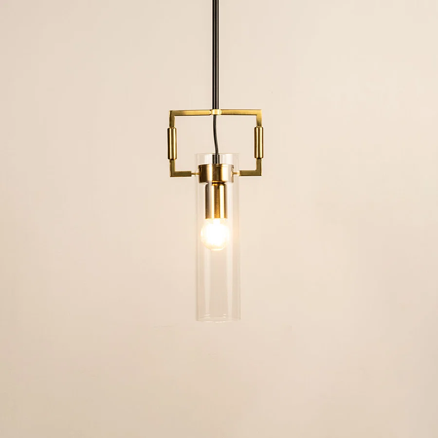Modern gold metal pendant light with clear glass rods for stylish dining room and luxury home decor styling.