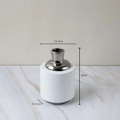 Modern ceramic vase with silver accent shown with height and diameter measurements for better size reference.