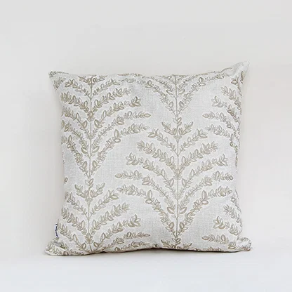 White cotton cushion cover with beige botanical leaf print for sofa bedroom seating and elegant home decor styling.