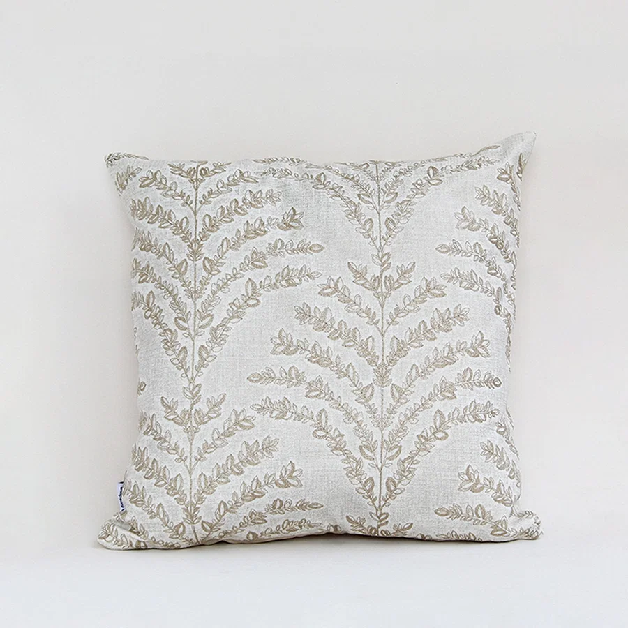 White cotton cushion cover with beige botanical leaf print for sofa bedroom seating and elegant home decor styling.