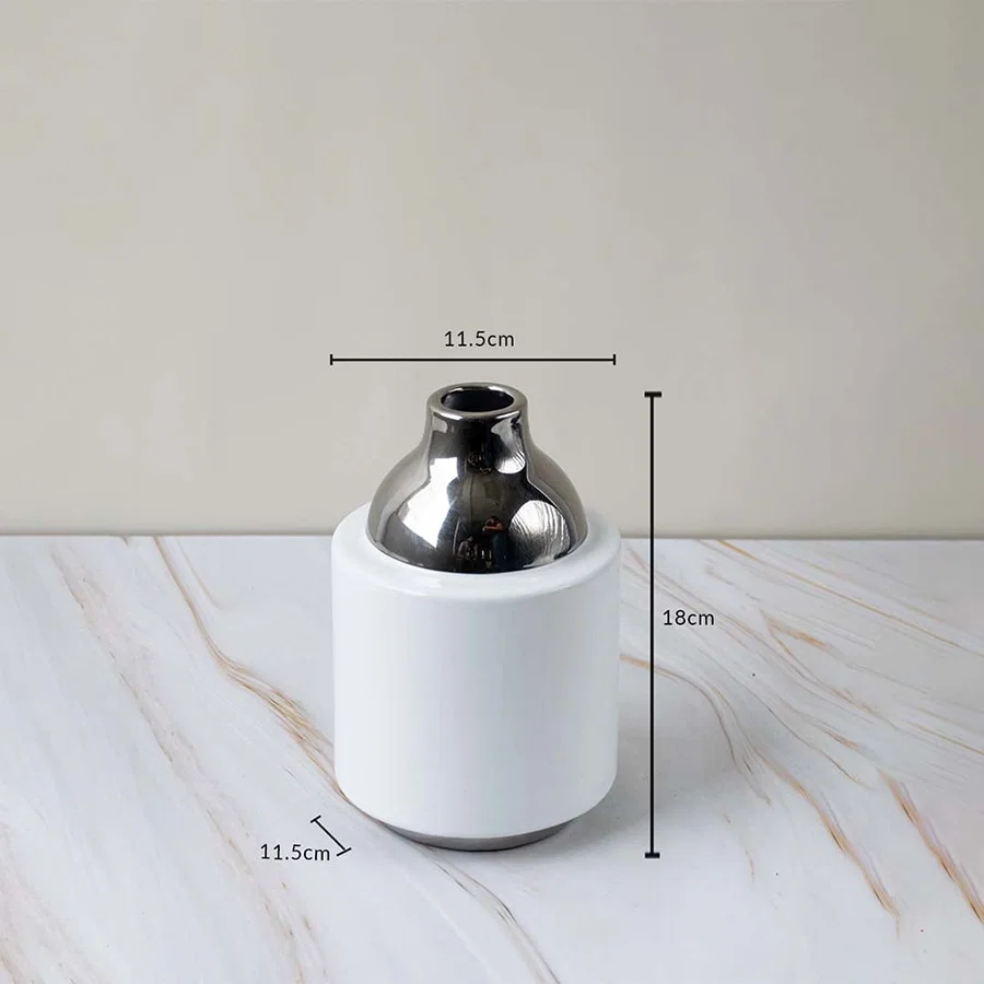 Ceramic vase with glossy white body silver neck size 18cm height 11.5cm width perfect for tabletop and home decoration.
