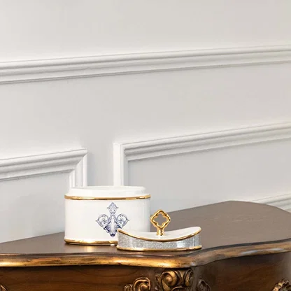White ceramic rectangular jar with blue floral artwork in a front view ideal for refined décor styling and modern console accents.
