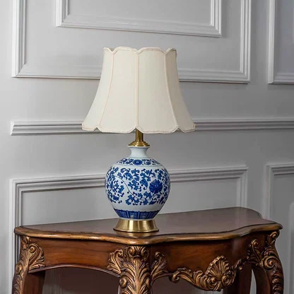 Blue and white ceramic table lamp with fabric shade designed for elegant traditional decor and ambient lighting.