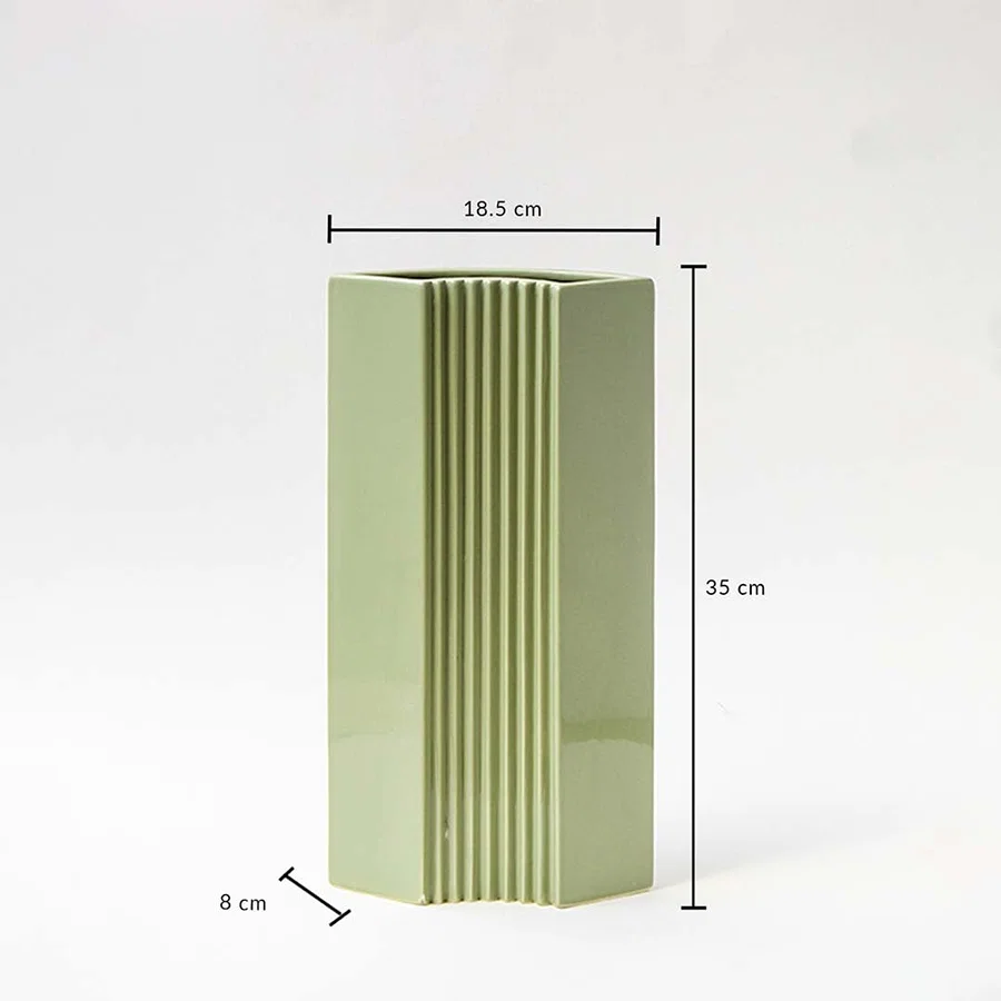 Green modern vase shown with dimensions 35 cm height 18.5 cm width and 8 cm depth highlighting its tall slim structure and ribbed detailing for accurate size reference.