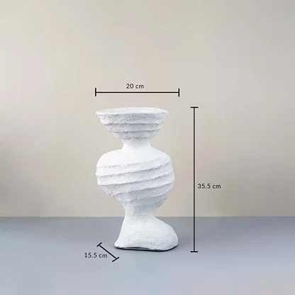 White ceramic sculptural vase with textured design measured for stylish modern table decor and home styling.
