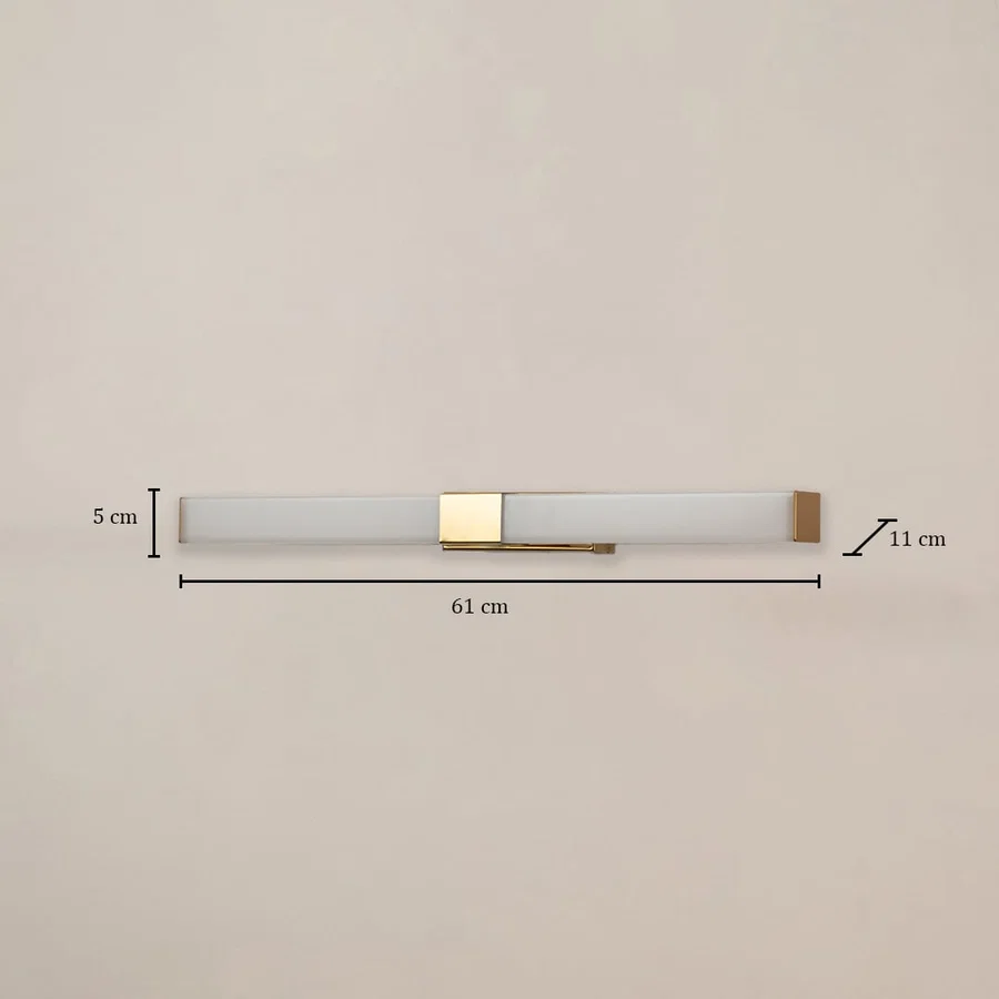 White and gold picture light measuring 61 cm width and 11 cm depth shown on white background for accurate wall lighting planning.