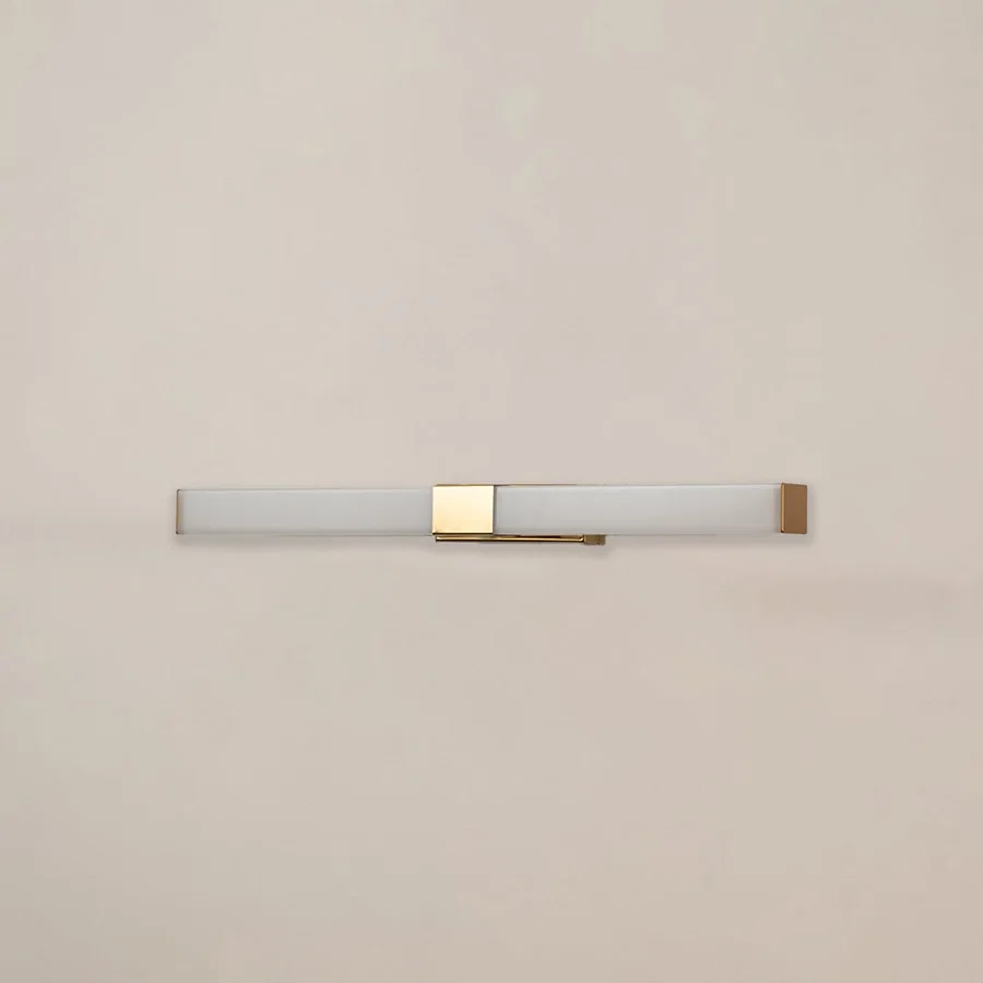 White and gold picture light with light off on white background perfect for art walls living rooms and contemporary home decor.