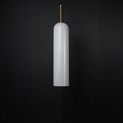 A glossy tall pendant light with the light off showcasing its reflective glass finish and metal accents clearly against a solid black background for a bold presentation.