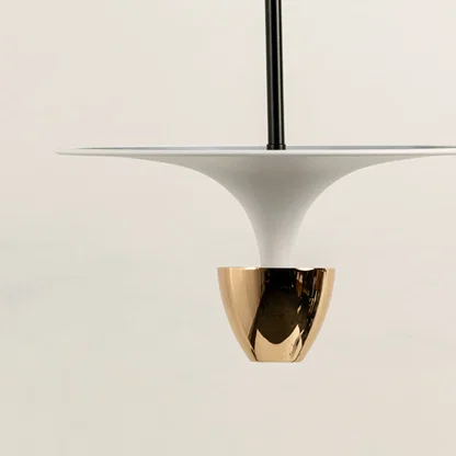 Closeup of white pendant light with gold metallic accent for luxury modern interior and dining decor styling.