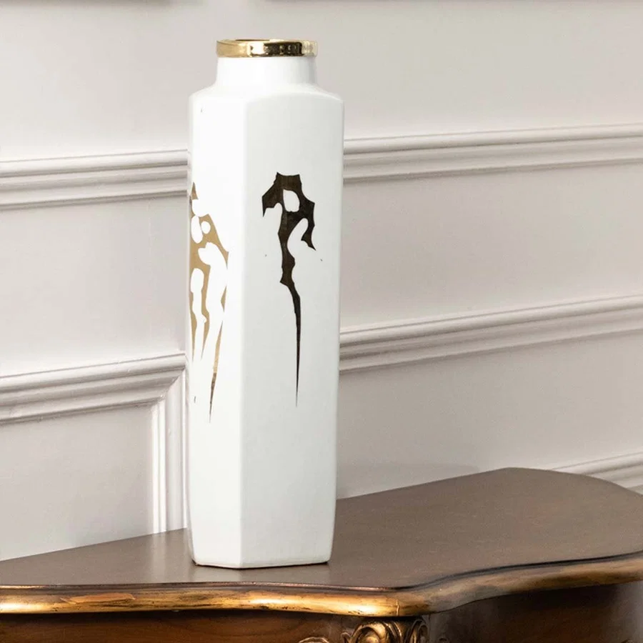 Tall white ceramic jar with gold horse artwork in a front view ideal for luxury décor styling and elegant living room placement.