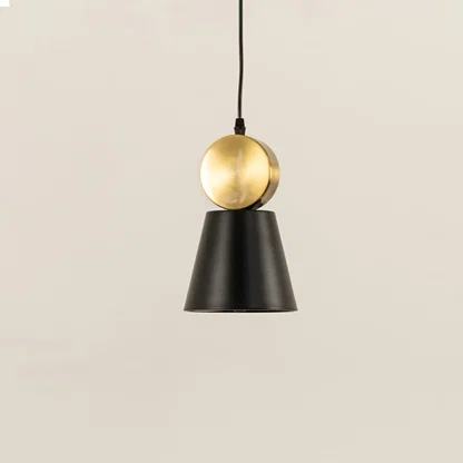 Black and gold metal pendant light with minimal cone design perfect for modern kitchen island or dining space decor.