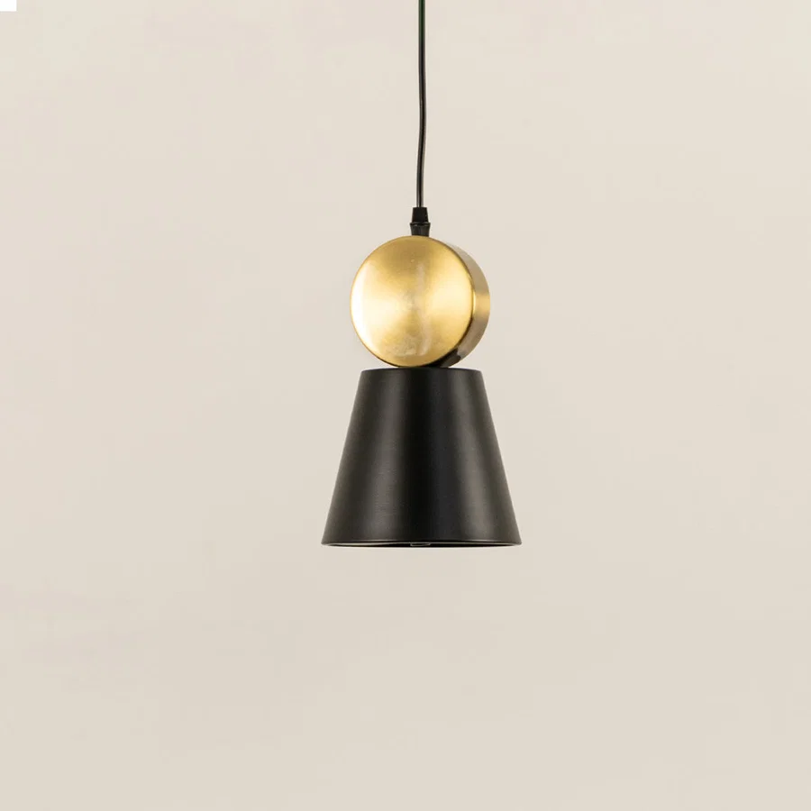 Black and gold metal pendant light with minimal cone design perfect for modern kitchen island or dining space decor.