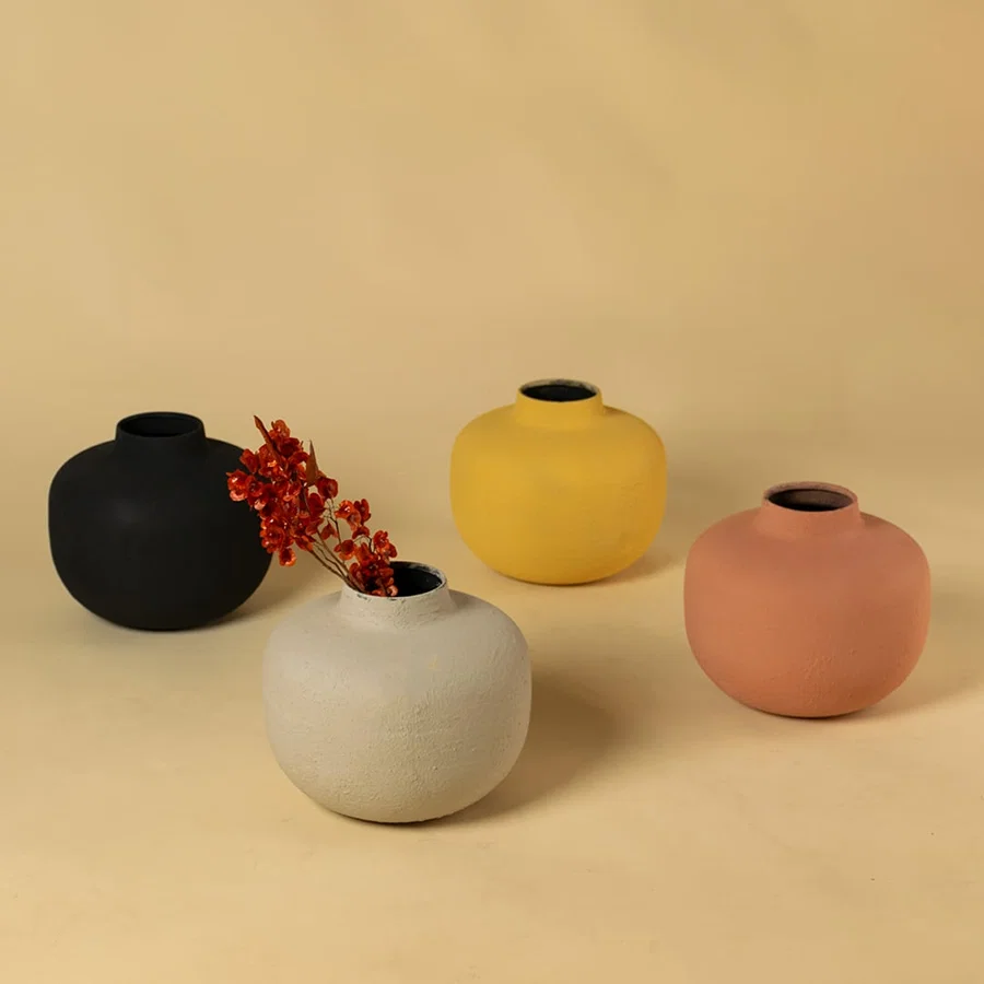 Yellow metal textured vases arranged together creating a vibrant modern decor look ideal for centre tables shelves and consoles.
