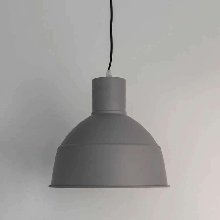 Minimalist white metal pendant light with smooth dome shade designed for contemporary home interiors.
