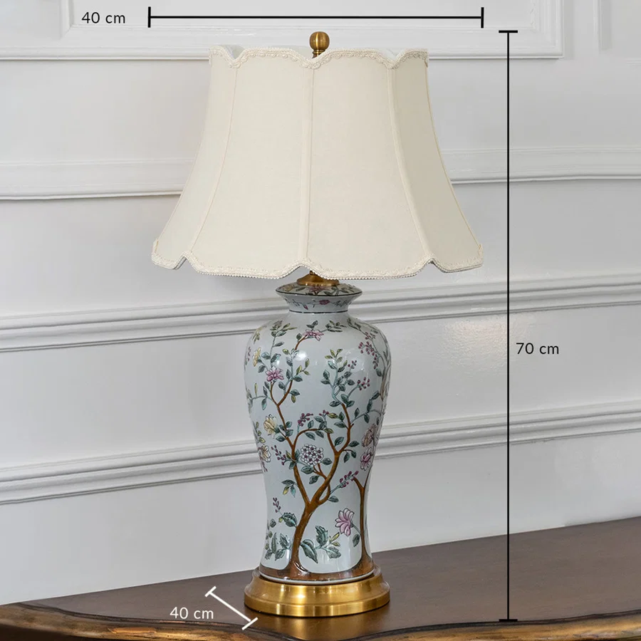 White floral ceramic table lamp with fabric shade measuring 70 cm height creating elegant traditional table lighting.