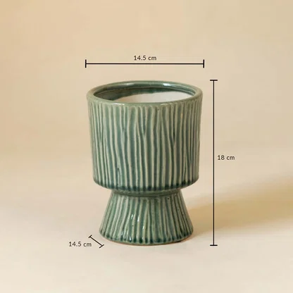 Green ribbed ceramic vase shown with 18 cm height and 14.5 cm width measurement for stylish interior decoration.