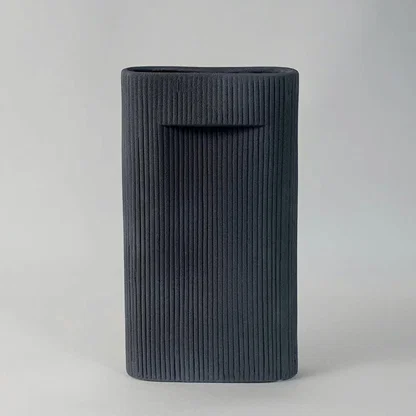 Elegant tall ceramic vase in matte black finish with vertical ribbed design perfect for living room and office decoration.