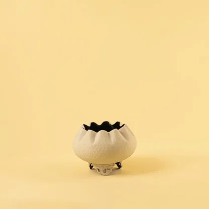 Cream metal scalloped bowl planter decor on a clean white background highlighting its textured elegant finish for home styling.