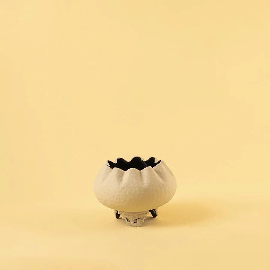 Cream metal scalloped bowl planter decor on a clean white background highlighting its textured elegant finish for home styling.