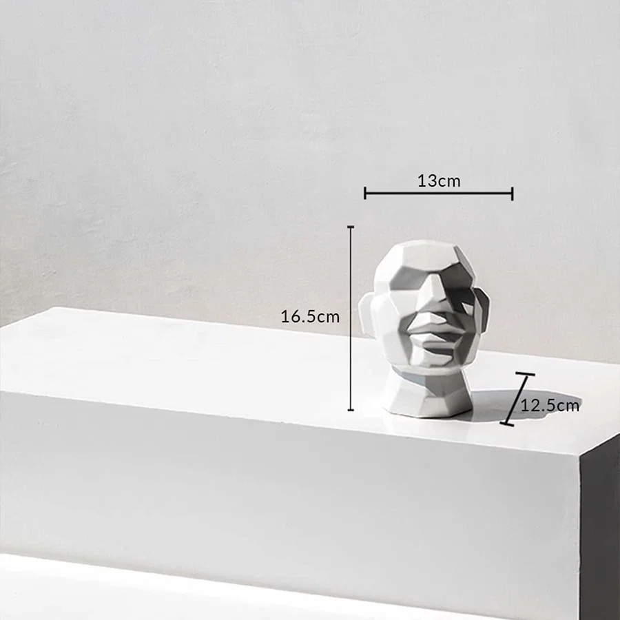 White geometric face sculpture showing 16.5 cm height and 13 cm width ideal for decorative tabletop display.