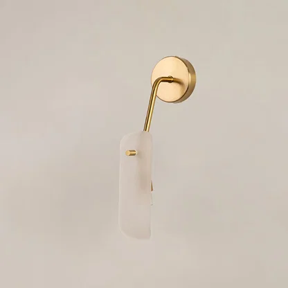 Gold wall light with frosted glass shade displayed on a bright white background with lights off for a minimal modern look.