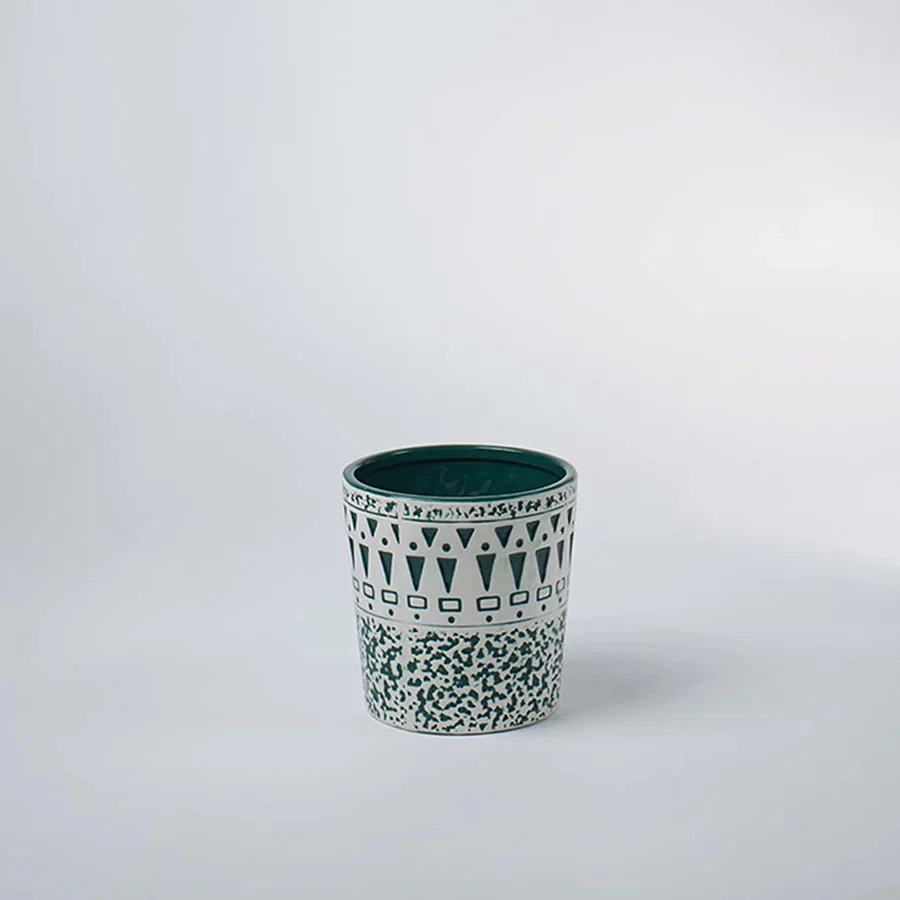 Green ceramic decorative planter with intricate patterned finish for tabletop styling and modern home decor displays.