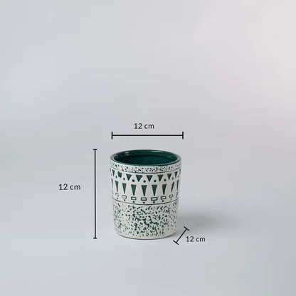 White and teal ceramic planter shown with 12 cm height and 12 cm width offering a clear accurate size reference.