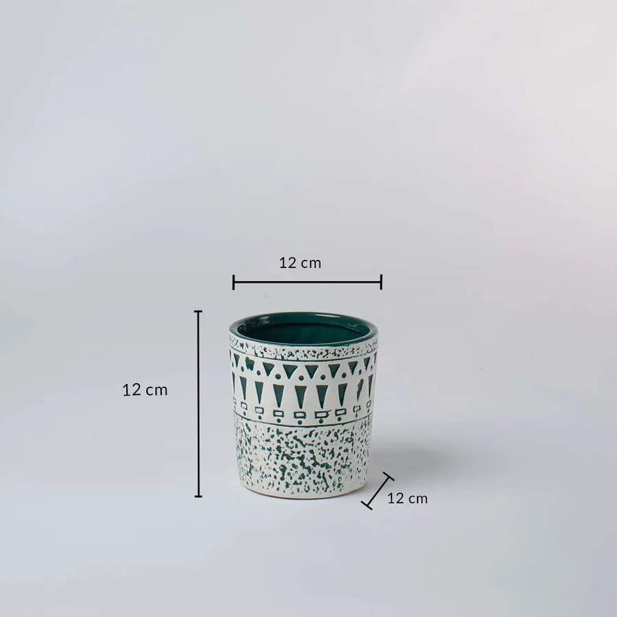 White and teal ceramic planter shown with 12 cm height and 12 cm width offering a clear accurate size reference.