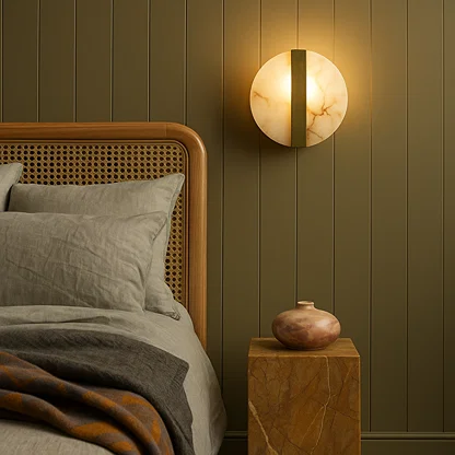 Modern marble and gold wall light with warm glow for elegant bedroom and luxury decor styling spaces.