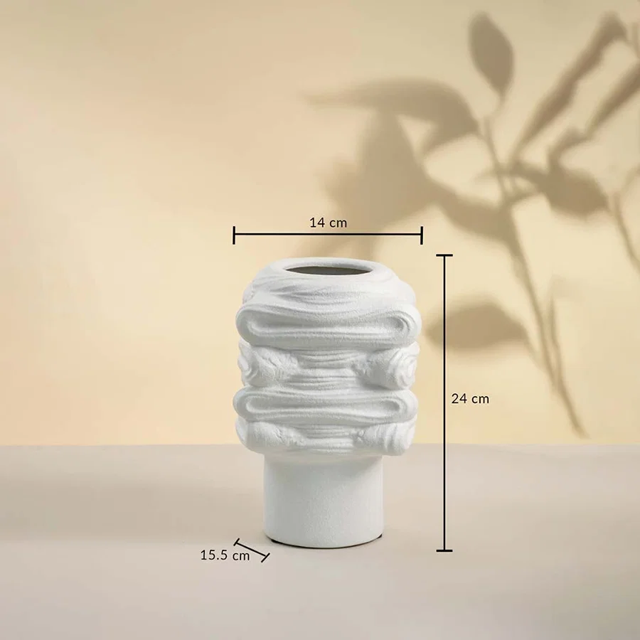 White handcrafted ceramic vase with sculptural pattern displayed on white background showing height 24 cm and width 14 cm for tabletop styling.