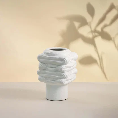 White ceramic decorative vase with stacked sculptural silhouette for contemporary tabletop styling and home decor.