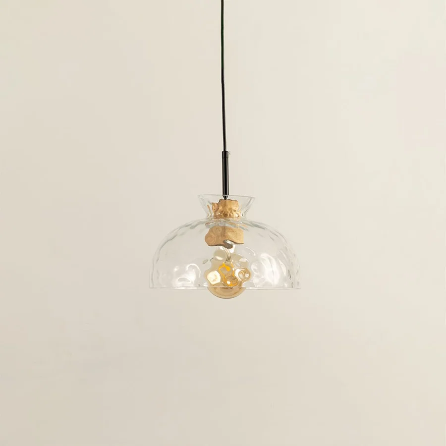 Clear artistic glass and brass metal pendant light with vintage charm for refined home interiors.