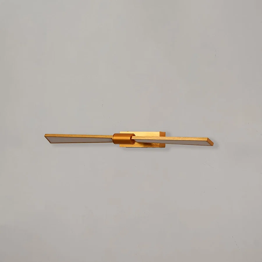 Gold metal picture light with sleek linear design for illuminating artwork mirrors and decorative wall displays.