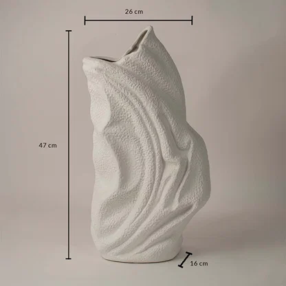 White ceramic decorative vase with wavy texture showing 47 cm height 26 cm width and 16 cm depth on white background.