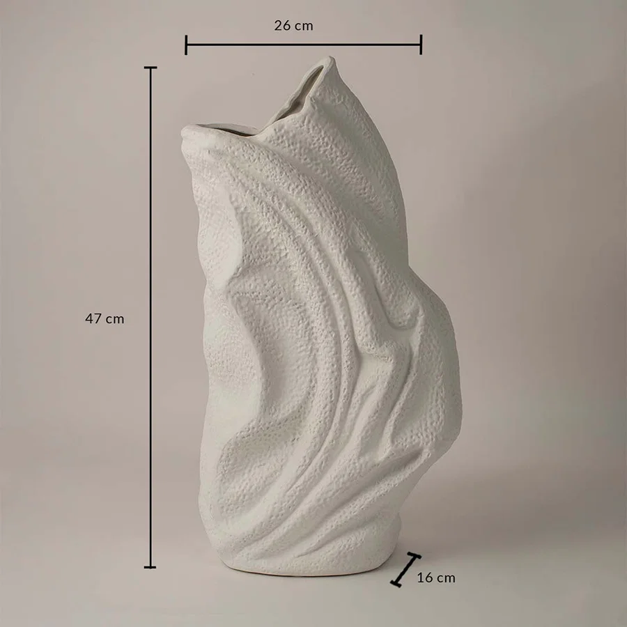 White ceramic decorative vase with wavy texture showing 47 cm height 26 cm width and 16 cm depth on white background.