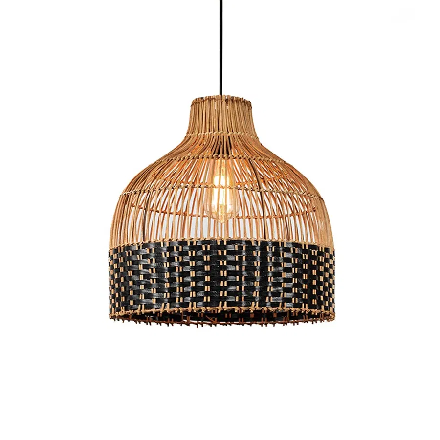 Natural cane pendant light with rounded dome shape and black woven base detail suspended on clean neutral wall background for modern rustic interior decor.