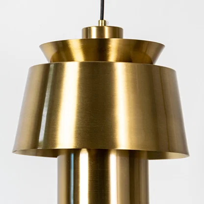 Brass metal pendant light featuring layered sculptural form and brushed finish showcasing refined modern craftsmanship.