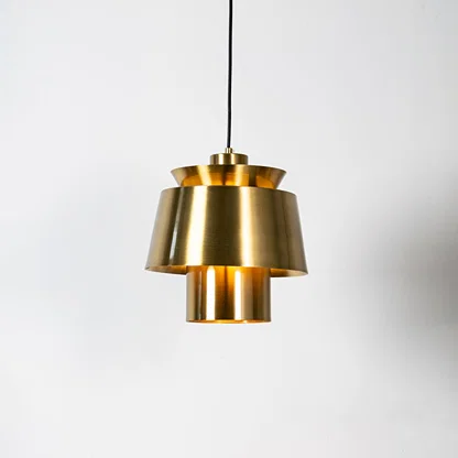 Brass metal pendant light with layered geometric design and brushed finish for sophisticated ceiling lighting decor.