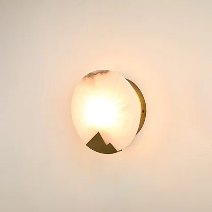 Modern marble wall light with warm ambient glow for elegant hallway and luxury decor styling spaces.