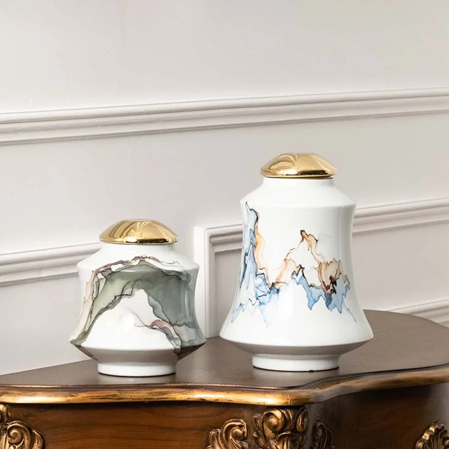 White ceramic jars with blue horse artwork ideal for classic console décor and elegant home styling.