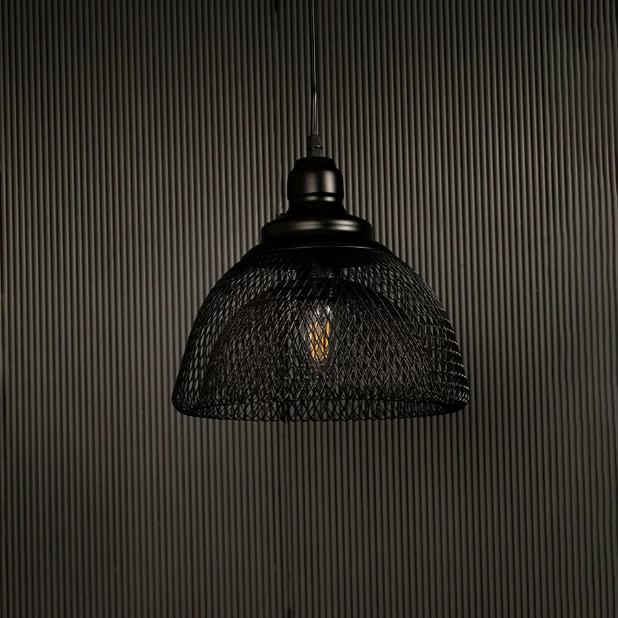 Modern industrial black mesh pendant light displayed on dark background with lights off showing contemporary artistic design.