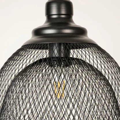 Black metal mesh pendant light closeup highlighting intricate wire detailing and premium industrial lighting craftsmanship.